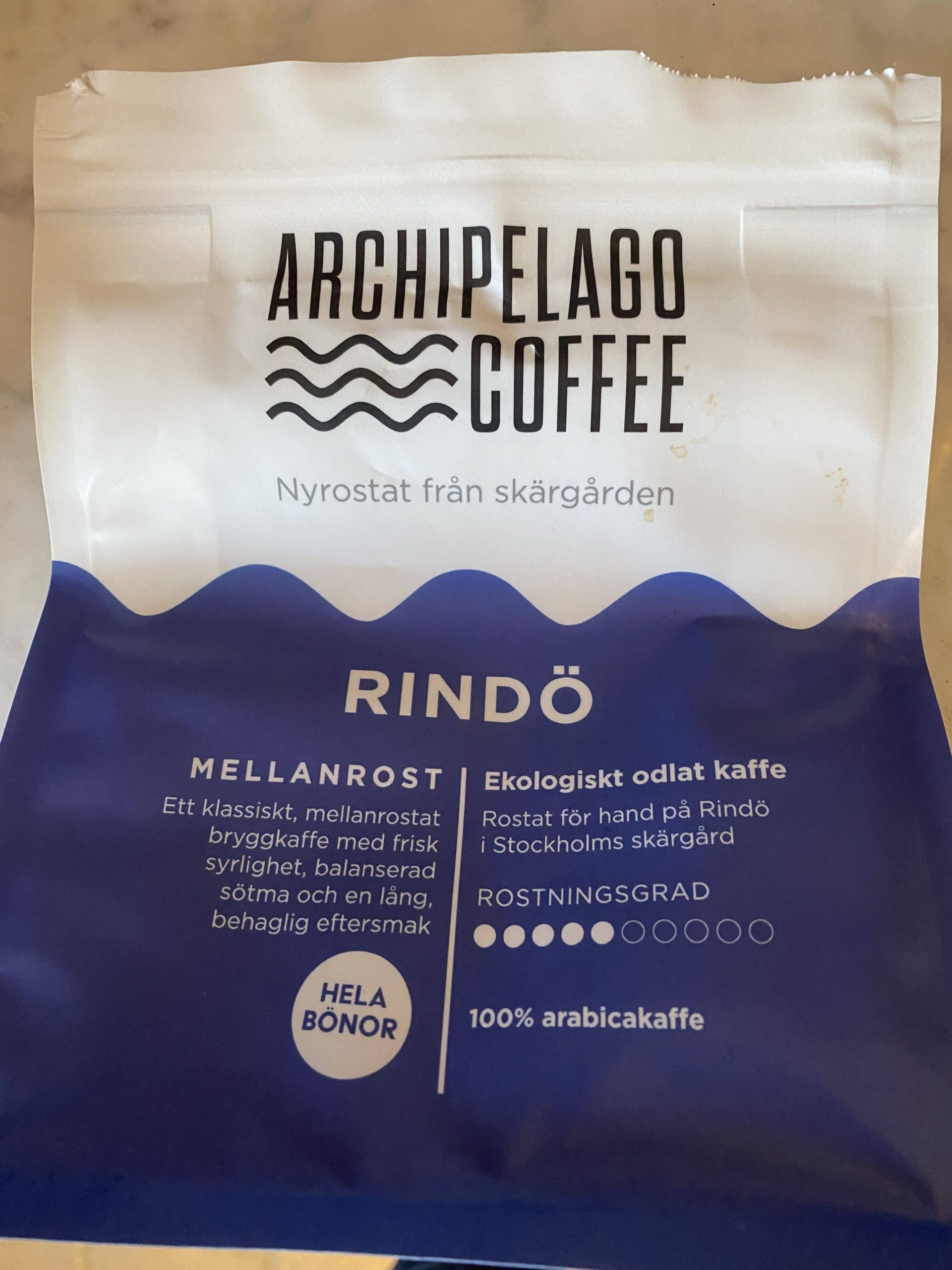 Image shows a bag (ripped open at top) of Archipelago Coffee's Rindo Blend.