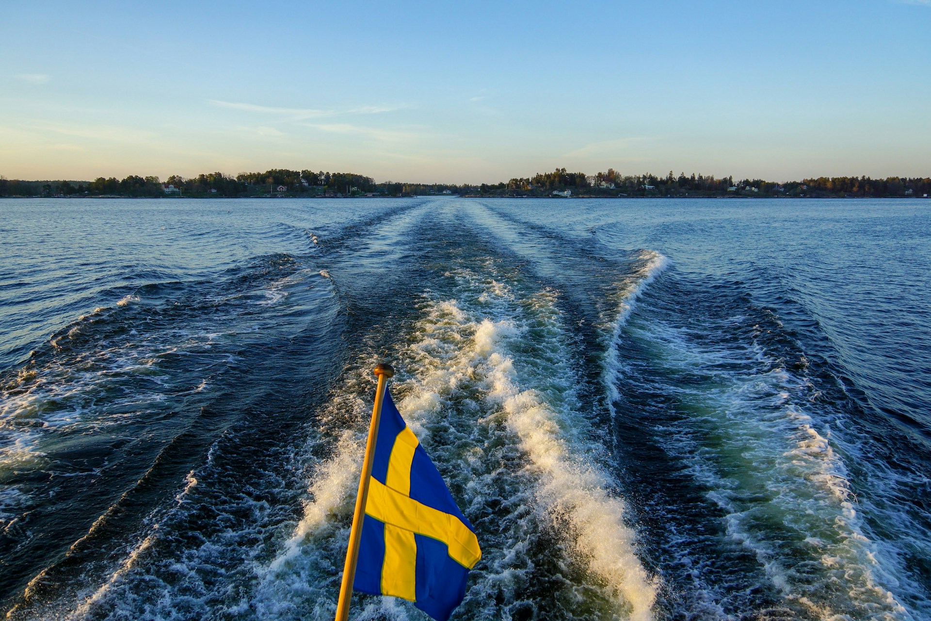 Swedish flag over water